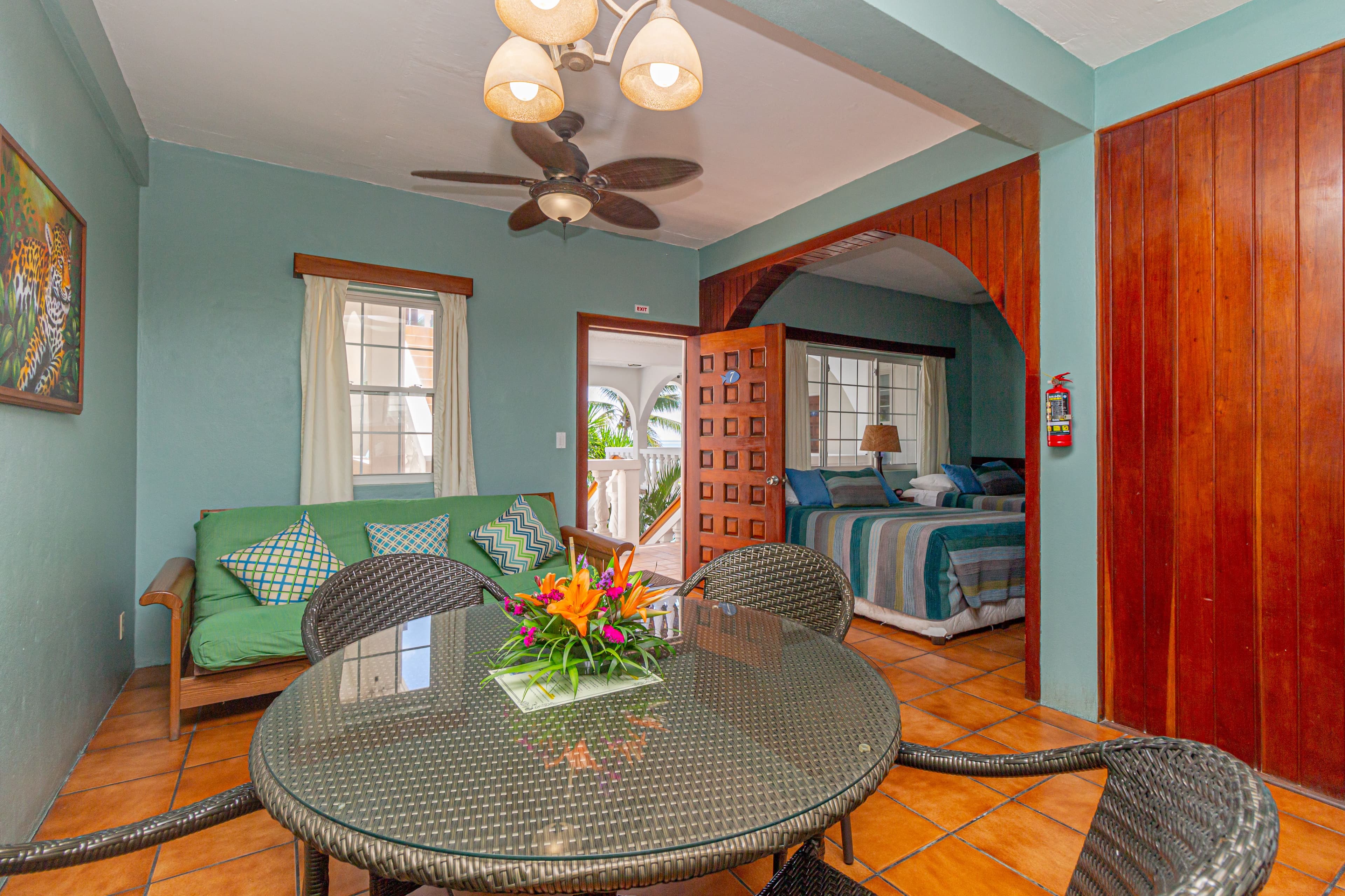 The suite has 2 double beds, futon, fully equipped kitchen, a/c, ceiling fans TV with Cable and WiFi