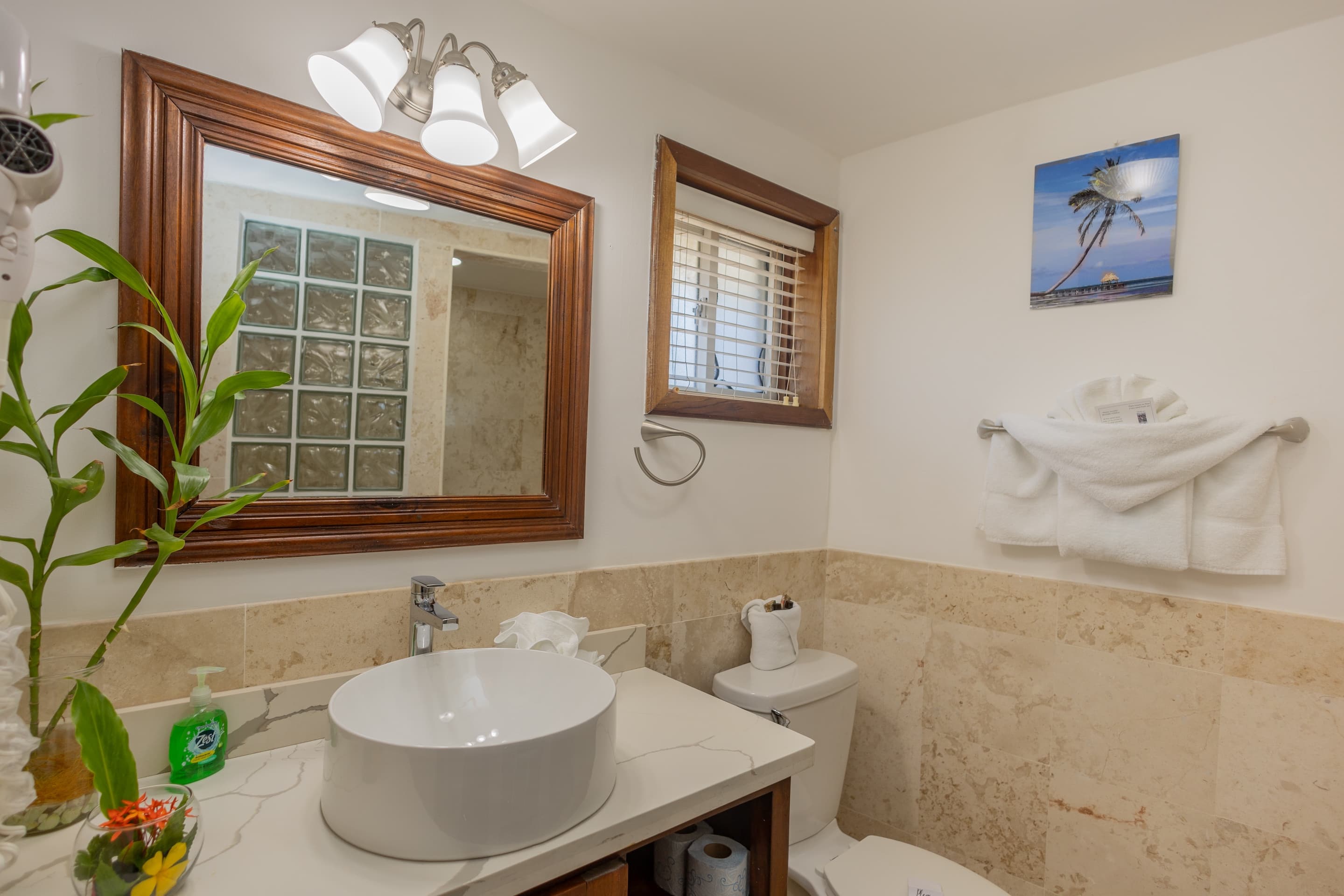 New Bathroom with glass block and tile shower, sink with granite