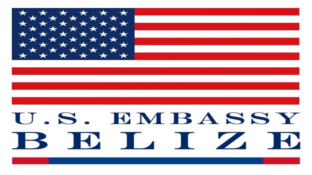 Logo of the U.S. Embassy in Belize featuring the American flag.