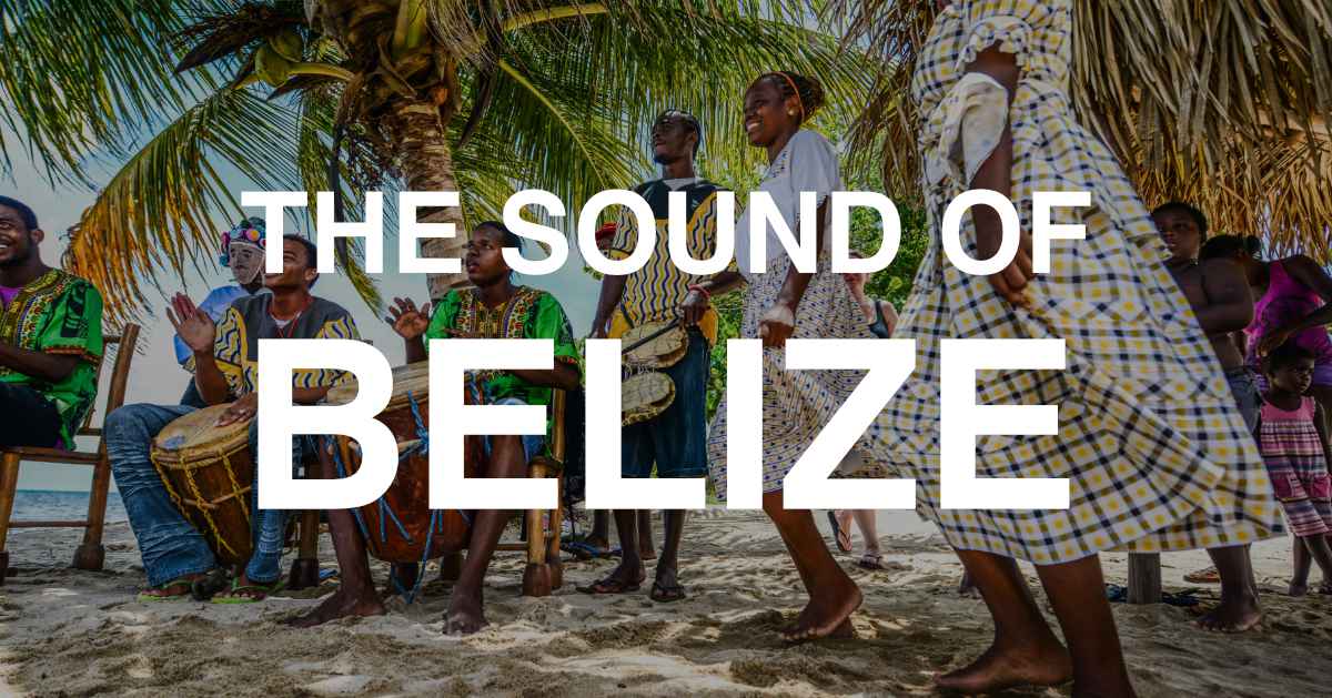 A vibrant group of musicians and dancers perform on a sandy beach under palm trees, celebrating the culture of Belize. A vibrant group of musicians and dancers perform on a sandy beach under palm trees, celebrating the culture of Belize.