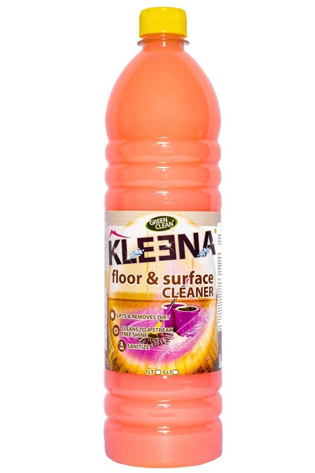 A bottle of Kleena floor and surface cleaner with a bright orange liquid and a yellow cap.
